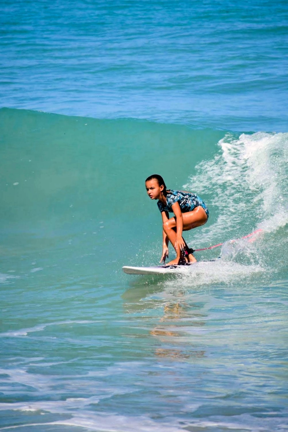 Child learning to surf at Playa Grande
