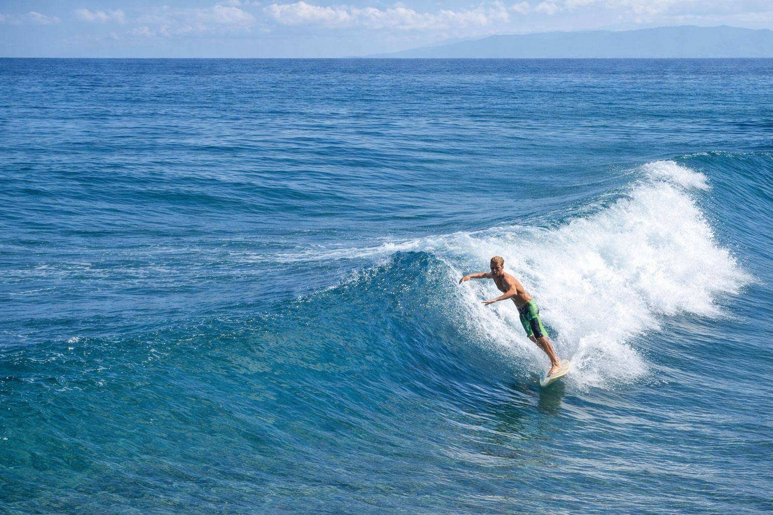 Surfer riding a powerful wave at Playa Grande, Dominican Republic