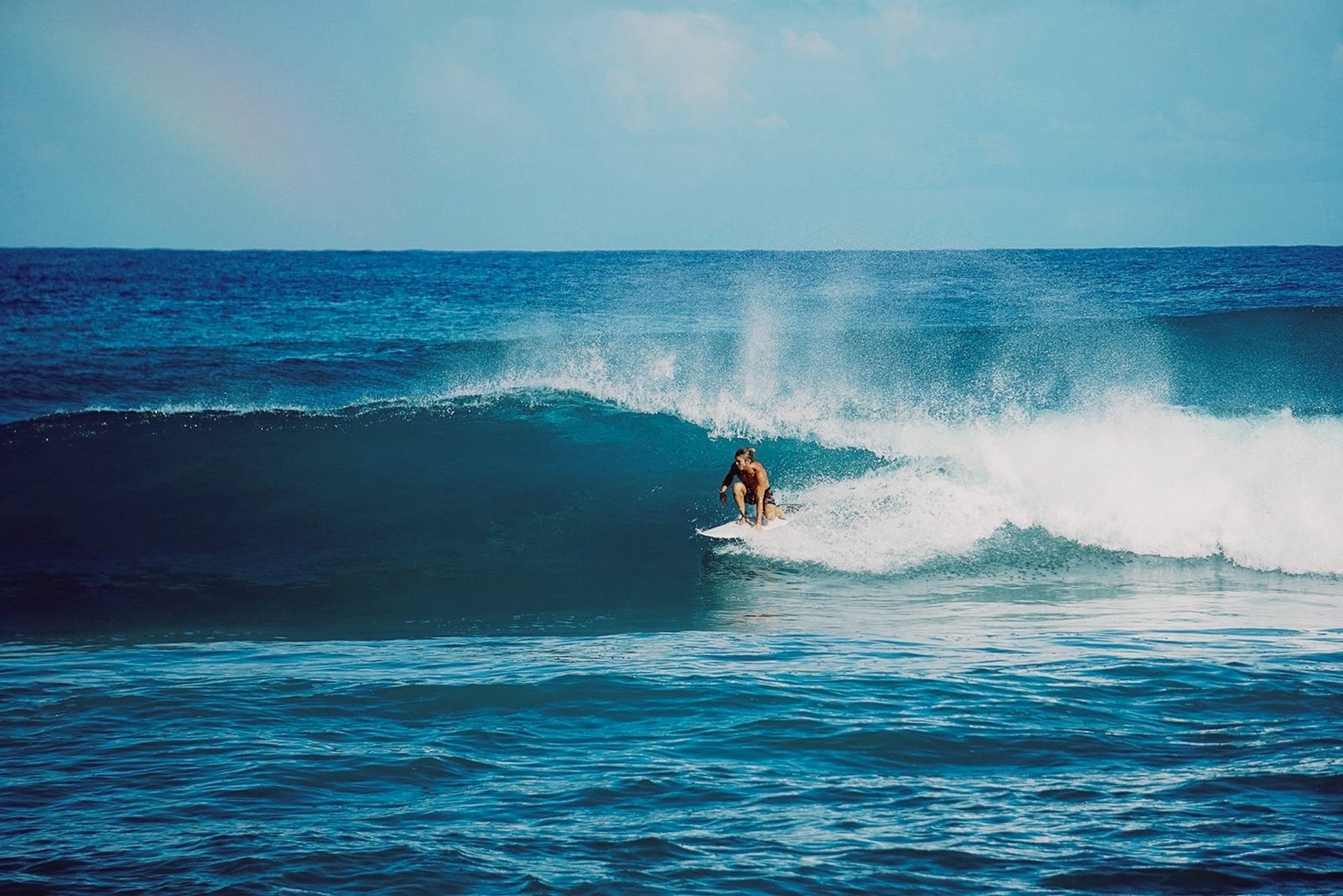 Surfer riding a powerful wave at Playa Grande, Dominican Republic